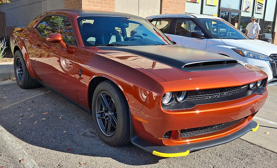 Real-world reference photo: Dodge Challenger SRT Demon 170 in orange, front view