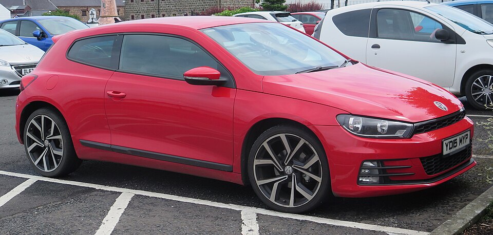 Real-world reference photo: Volkswagen Scirocco (Mk3) in red, front three-quarter view